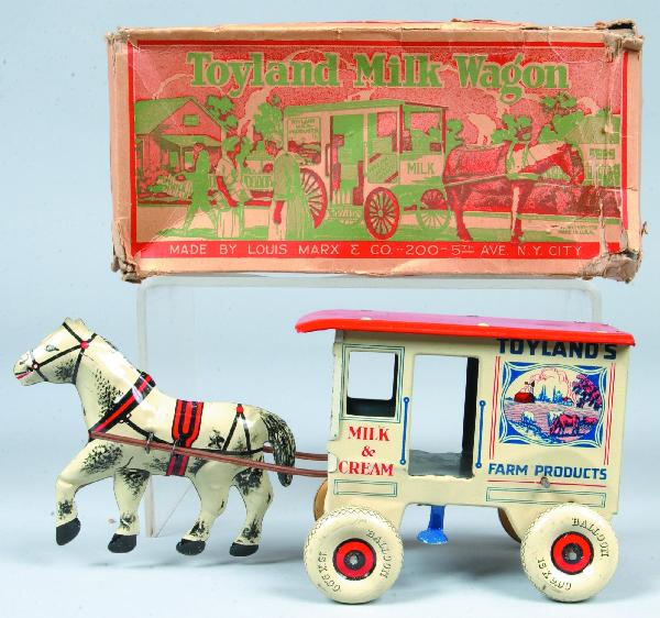 Marx Toyland Milk Wagon, tin lithograph wind-up, : Marx Toyland Milk Wagon, tin lithograph wind-up, white horse with balloon tires, with original tattered box. 4-1/2"h x 10-1/2"l. Condition: Very good with minor scratches.