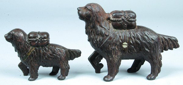 Two Cast Iron Dog Still Banks. Large and small ver: Two Cast Iron Dog Still Banks. Large and small version AC Williams Saint Bernard with pack. 3-3/4" and 5-1/2" high. Condition: Good with light rust and wear.