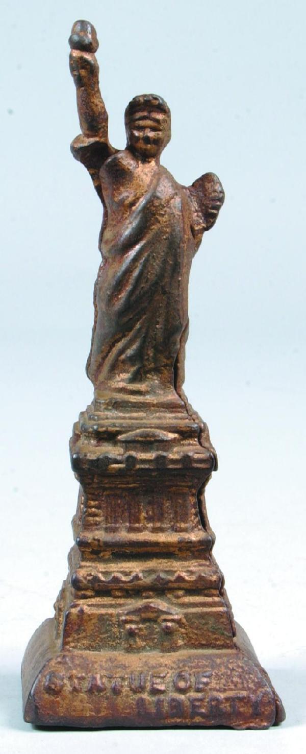 A. C. Williams Cast Iron "Statue of Liberty" Still: A. C. Williams Cast Iron "Statue of Liberty" Still Bank, circa. 1910-30. 6" high. Condition: Good with normal wear.