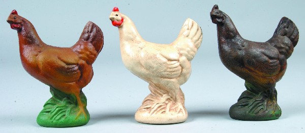 Three Cast Iron Hen Still Banks with white, tan an: Three Cast Iron Hen Still Banks with white, tan and brown paint schemes, 6" high. Condition: Very good.