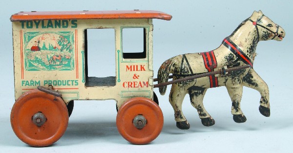 Marx Toyland Milk Wagon, tin lithograph wind?up, t: Marx Toyland Milk Wagon, tin lithograph wind-up, tan roof and tires with white horse . 4-1/2"h x 10-1/2"l. Condition: Good with minor scratches and scattered rust.