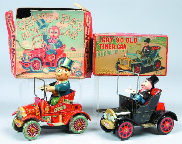 Two Japanese Tin Lithograph Wind-up Cars with orig: Two Japanese Tin Lithograph Wind-up Cars with original boxes; "Grand-Pa's New Car" and Gay 90 Old Timer Car", both 5-1/2" long. Condition: Cars excellent, boxes show tears and losses.