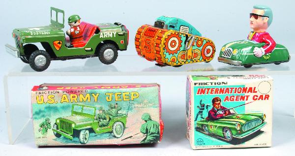 Lot of Three Tin Lithograph Toys; Marx "Internatio: Lot of Three Tin Lithograph Toys; Marx "International Agent Car" friction toy with box, 4" long, Marx Sparkling Tank wind-up, 4" long and Yone "U.S. Army Jeep" friction toy with box, 6-3/4" long. Cond