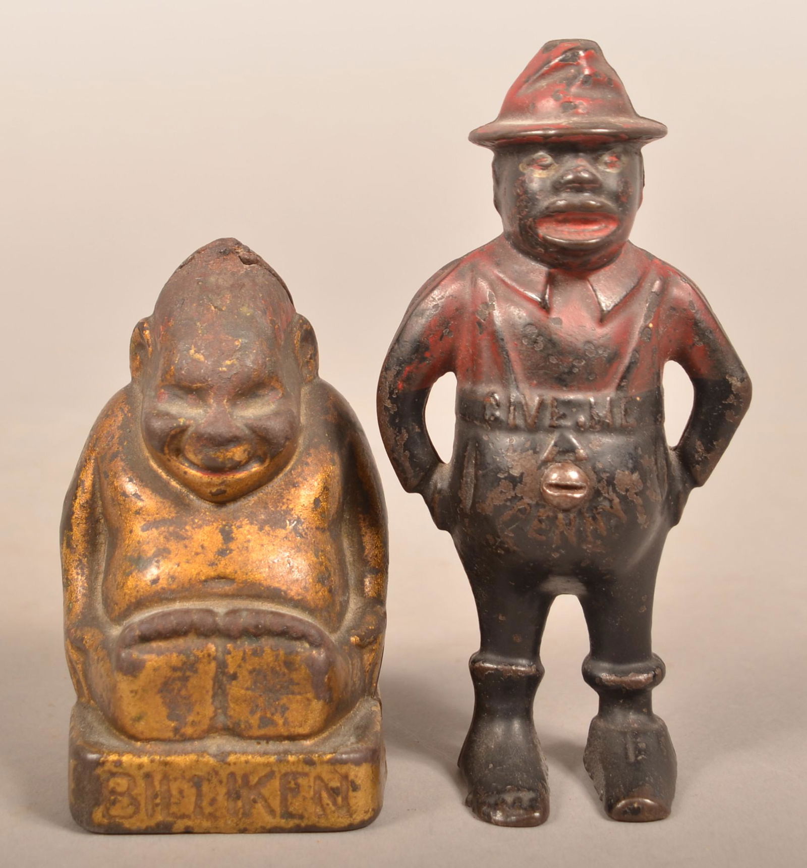 Two Antique Cast Iron Figural Still Banks. (1 of 4)