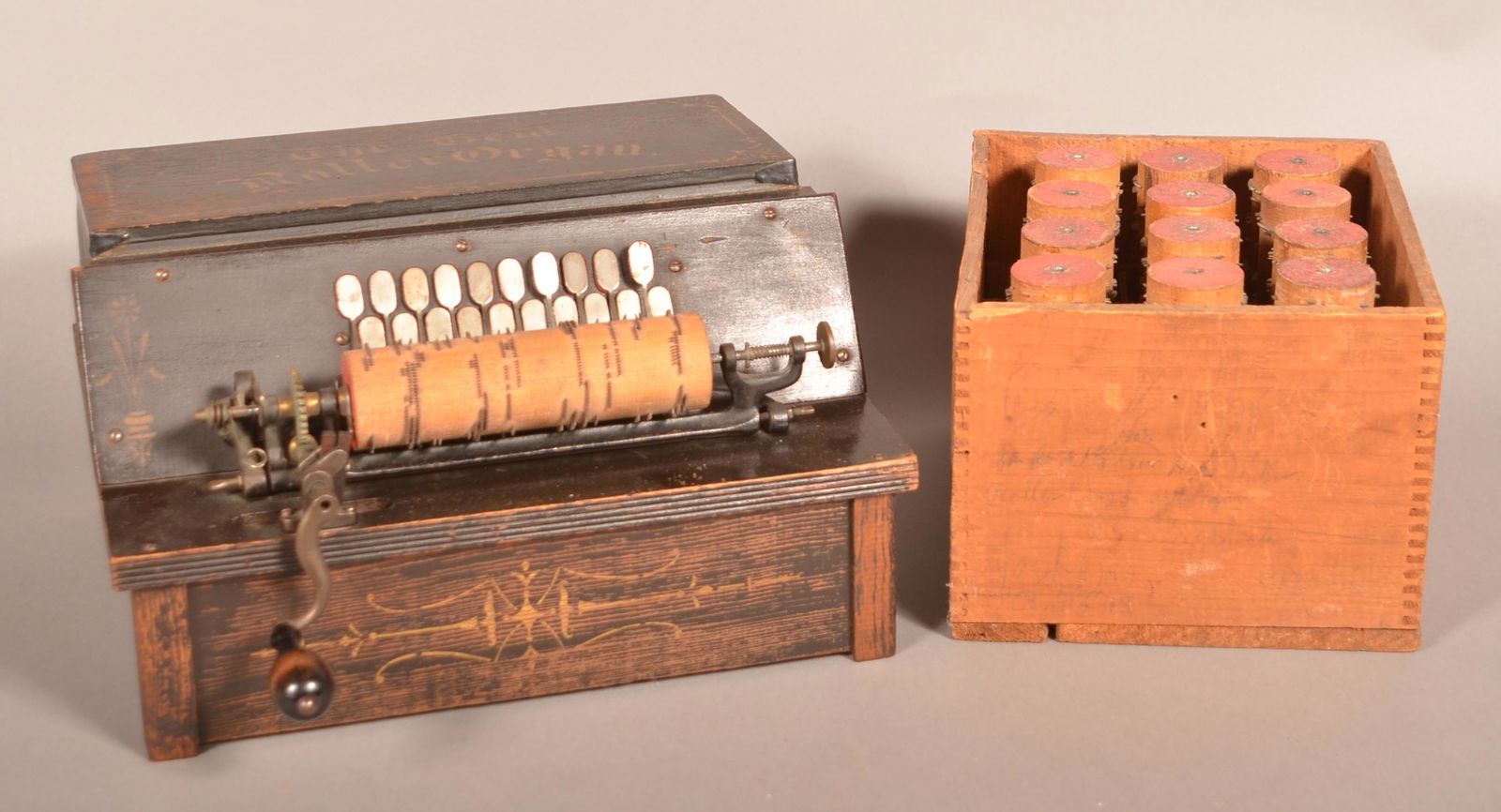 The Gem Roller Organ with Thirteen Rolls.: The Gem Roller Organ with Thirteen Rolls. Black ground with gold lettering and Eastlake style accents. 8"h. x 14-1/2"w. x 12"d. (not including crank). Condition: Good with wear. Working condition.
