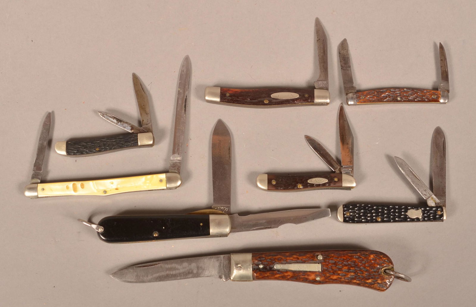 Eight Vintage Folding-Blade Knives.: Eight Vintage Folding-Blade Knives. Including Remington, Winchester and Case. Largest 8" long overall. Condition: Good with use wear.