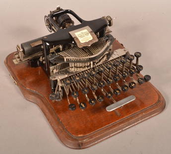 The Postal Typewriter Company Antique Typewriter.: The Postal Typewriter Company, Norwalk, Conn. Antique Typewriter. Circa 1902-1909. In quarter-sawn oak case. Case measures 6-3/4"h. x 13"w. x 14"d. Condition: Good to very good.