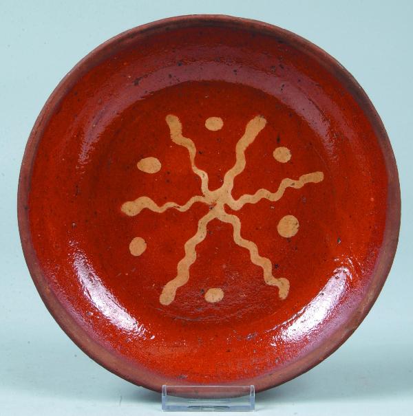 Pennsylvania Mid 19th Century Redware Pottery Plat: Pennsylvania Mid 19th Century Redware Pottery Plate with squiggle-line and polka-dot yellow slip decoration, 8-3/8" diam. Condition: Good.