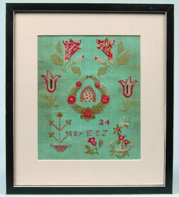 Needlework Sampler on punch paper, central buildi: Needlework Sampler on punch paper, central building in wreath flanked by flowers and anchor, "ECZ" and dated 24, framed and matted, 15-1/2"h. x 13-1/2"w. Condition: Good.
