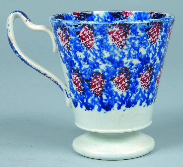 Unusual Blue and Red Sponge Ironstone China Strawb: Unusual Blue and Red Sponge Ironstone China Strawberry Thumbprint Flared-top Footed Mug with shaped handle. Bold double rows of red thumbprint design on blue sponge ground. 5-3/8" high. Condition: Ver
