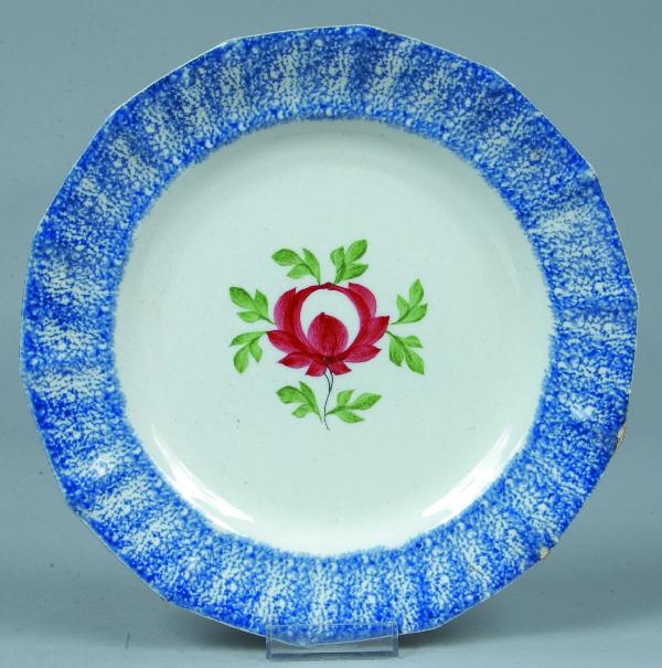 Blue Spatter Ironstone China Adams Rose Pattern Pa: Blue Spatter Ironstone China Adams Rose Pattern Paneled Plate, red flower with green leaves. 9-3/8" diam.. Condition: Good with minor edge chips.