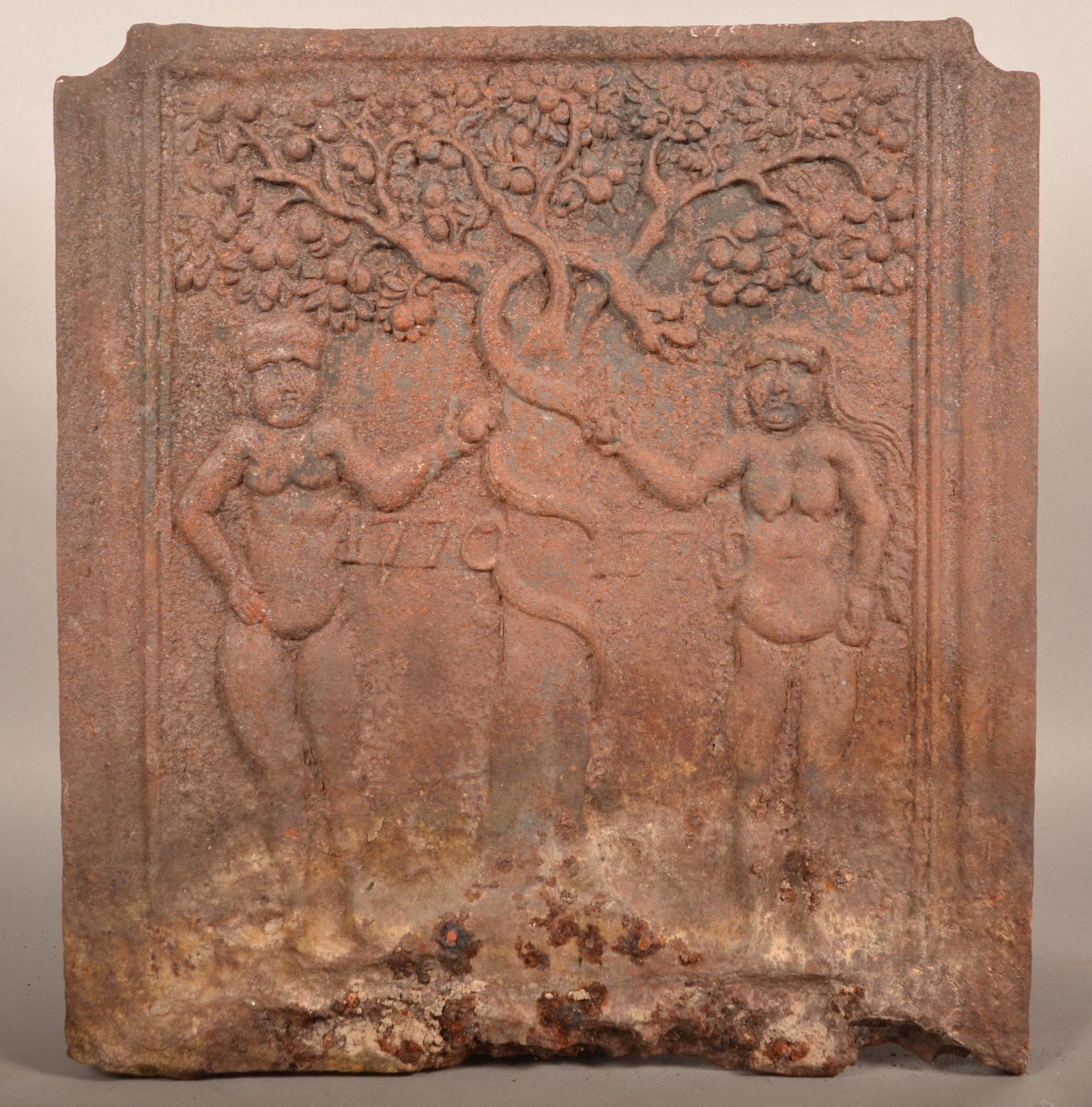 Adam and Eve Cast Iron Fireback Dated 1770.: Adam and Eve Cast Iron Fireback Dated 1770. See "Bible in Iron" by Dr. Henry C. Mercer plate #276, Adam and Eve under the fatal tree with the serpent. 25"h. x 23"w. Condition: Fair to good with loss m
