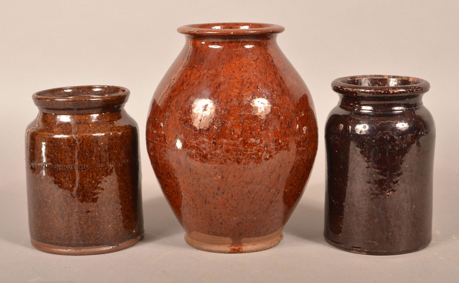 Three Various 19th Century Glazed Redware Storage Jars.: Three Various 19th Century Glazed Redware Storage Jars. Tallest 9-1/2"h. Condition: Good with chips and wear.