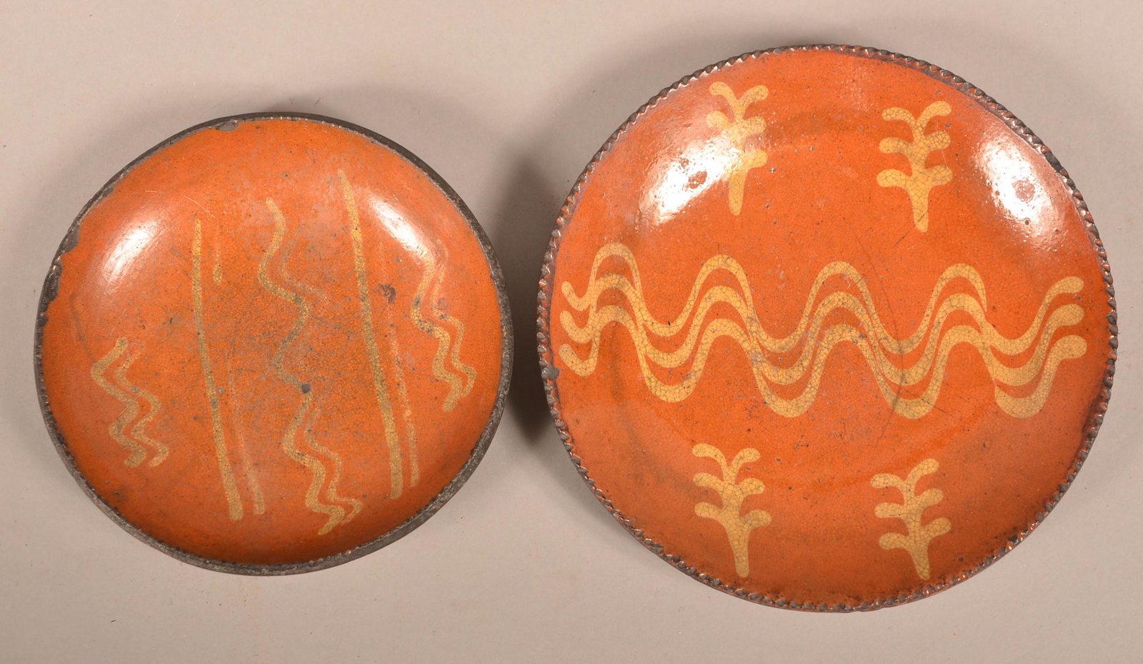 2 PA 19th Century Yellow Slip-Decorated Redware Plates.: Two Pennsylvania 19th Century Yellow Slip-Decorated Redware Plates. 7-1/2" and 9" diam. Condition: Good with edge chips and lines.