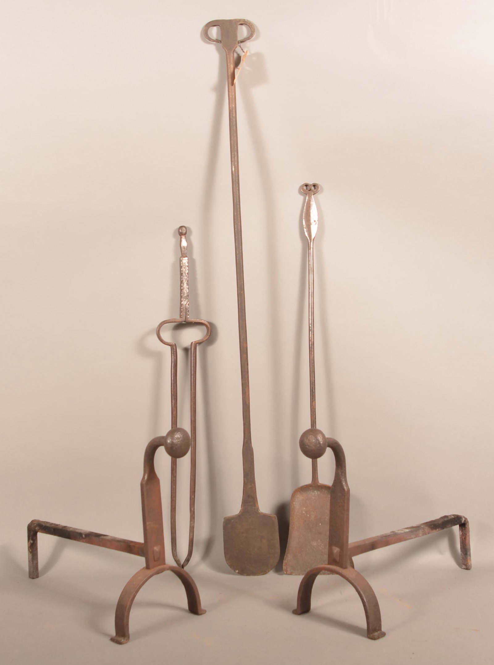 Lot of Antique Iron Hearth Equipment.: Lot of Antique Iron Hearth Equipment. Including a peel 43-1/2"l., file-notched tongs 28"l., shovel 31"l. and a pair of andirons 14-1/2"h. Condition: Good with pitting and rust.