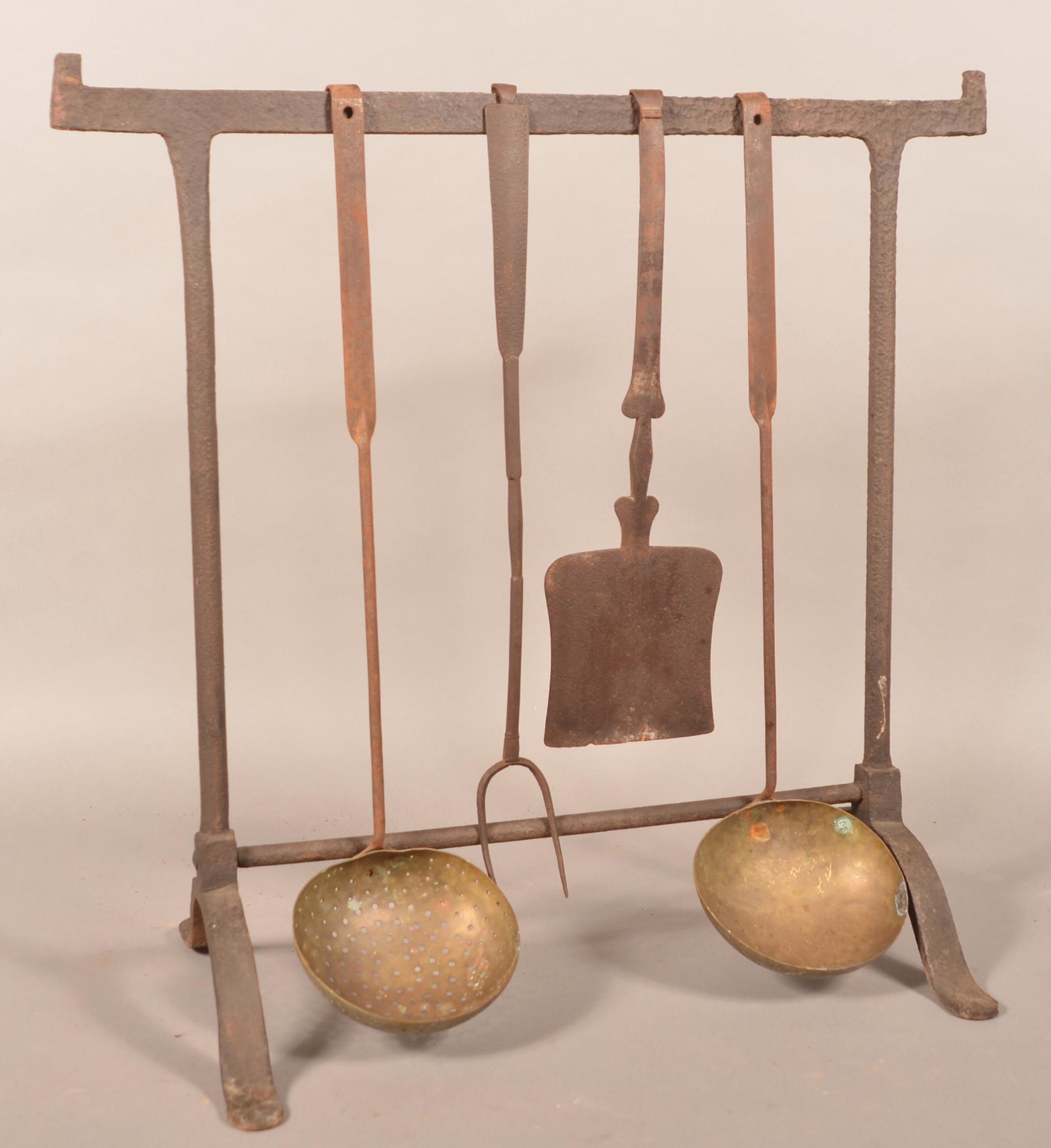 19th Century Wrought Iron Hearth Trestle with 4: 19th Century Wrought Iron Hearth Trestle with Four Utensils. 30"h. x 30-1/2"w. Condition: Good with rust and pitting.