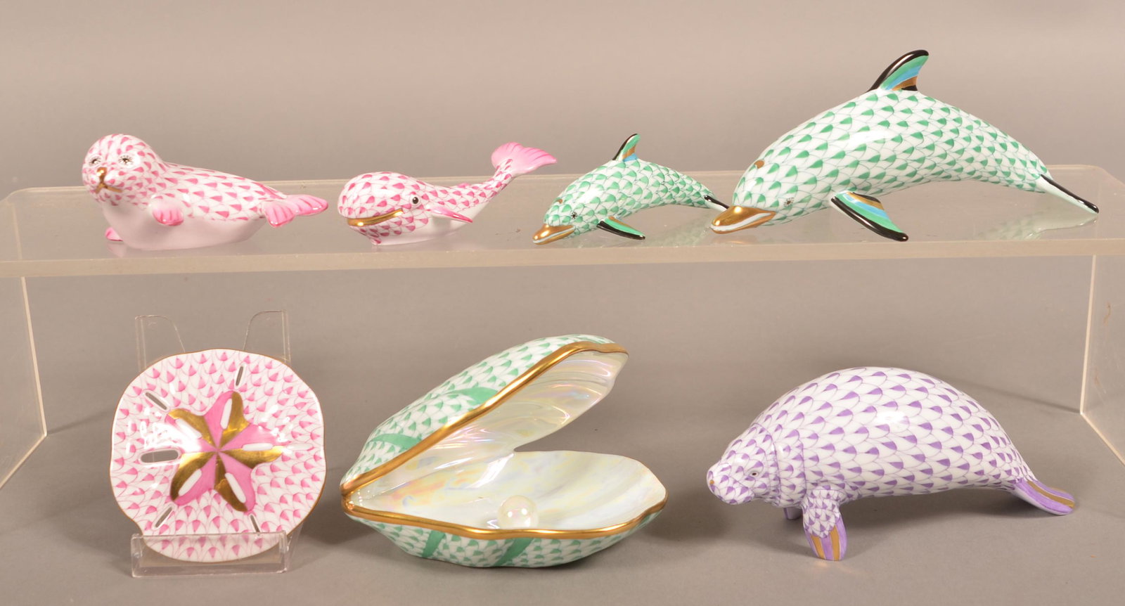 7 Herend Hand-Painted Porcelain Sea Creature Figurines.: Seven Herend, Hungary Hand-Painted Porcelain Sea Creature Figurines. Includes; two dolphins, manatee, whale, fur seal, sand dollar and a clam with pearl. 3" to 5-1/2"l., 1-1/2" to 4-1/4"h. Condition: 