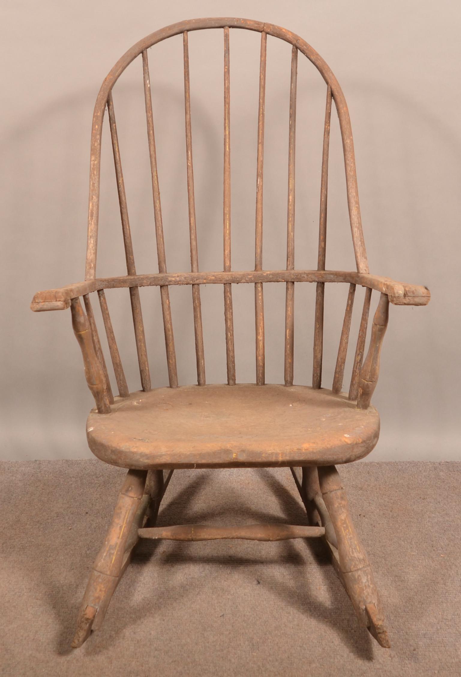 18th Century Windsor Bow-Back Rocking Chair.: 18th Century Windsor Bow-Back Rocking Chair. Seven spindle-back, bamboo turned bases with saber rockers. Seat height 15"; 41-1/2"h. overall. Condition: Fair with breaks, wear and losses.