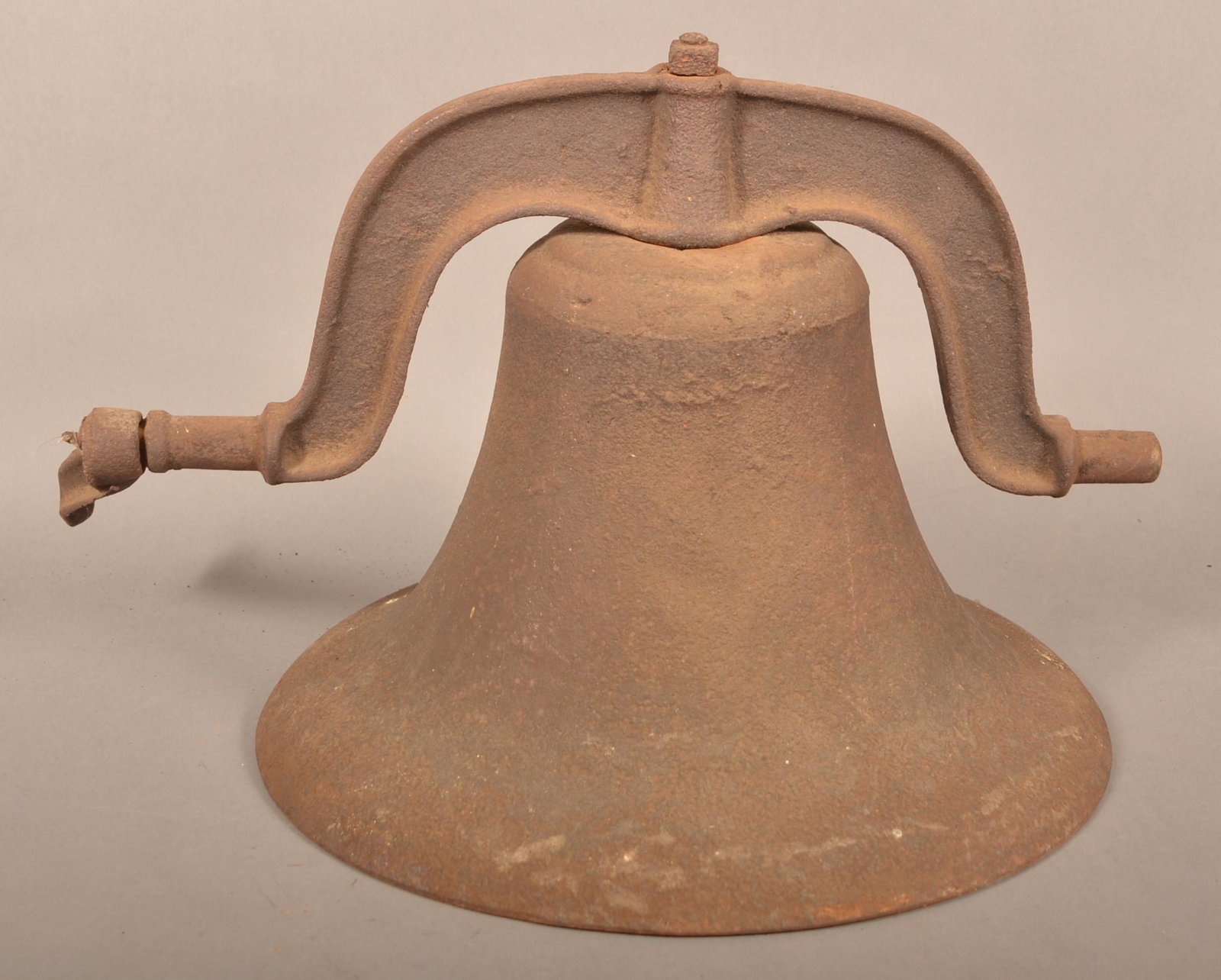 19th Century Cast Iron School Bell.: 19th Century Cast Iron School Bell. 12"h x 15-3/4" bell diam. Condition: Good with rust and pitting.