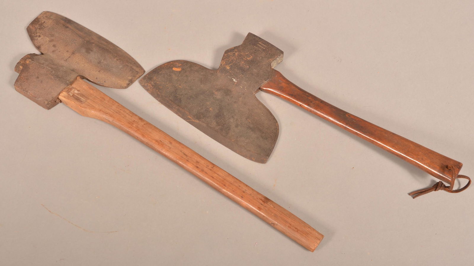 Two Signed Antique Iron Broad Axes.: Two Signed Antique Iron Broad Axes. Keely Mfg. Co., blade 11"w. and C. Hammond, Philad., blade 12"w. Condition: Good with rust and pitting.