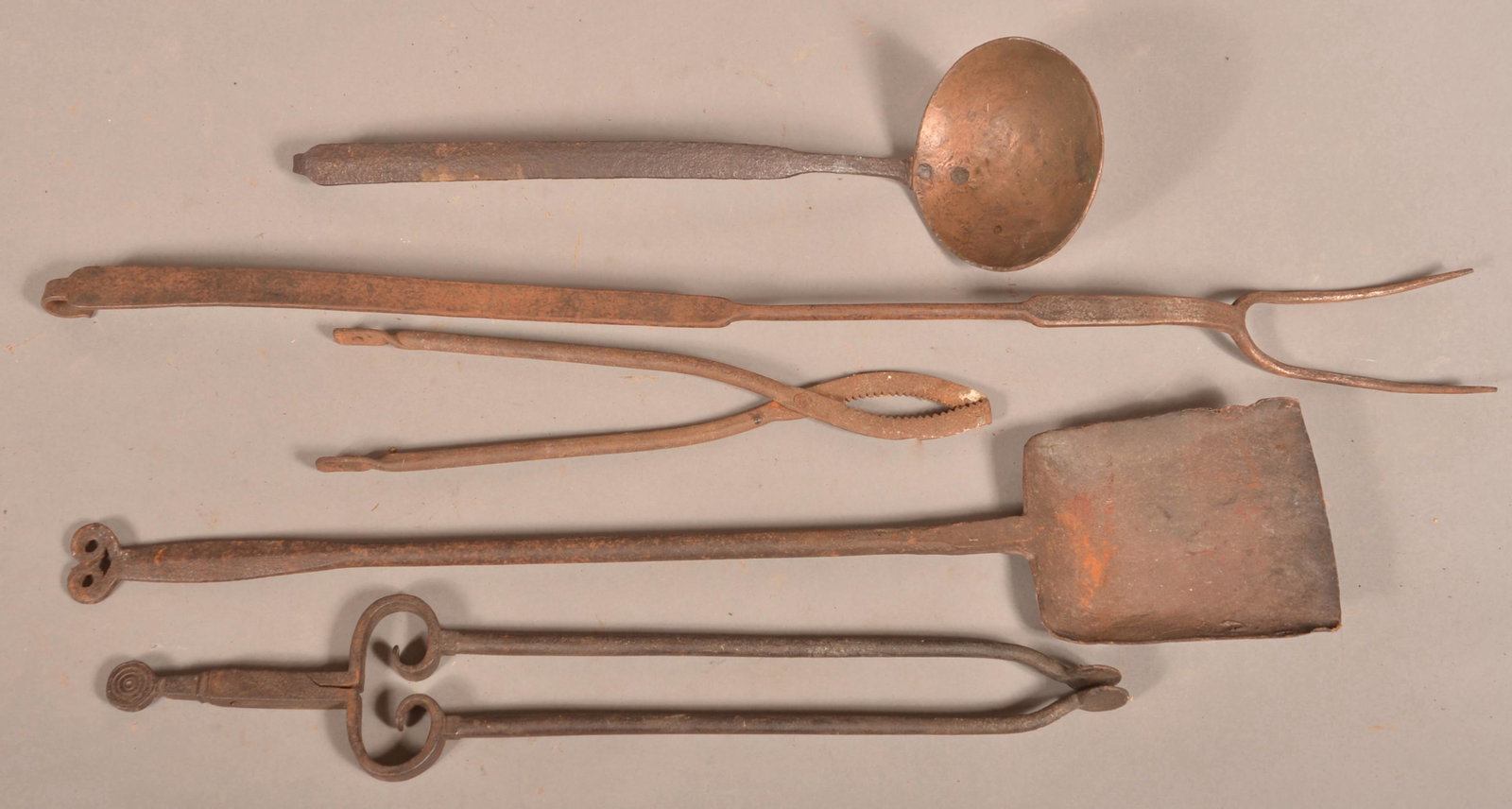 Five Antique Wrought Iron Hearth Tools.: Five Antique Wrought Iron Hearth Tools. Largest 37"l. Condition: Good with rust and pitting.