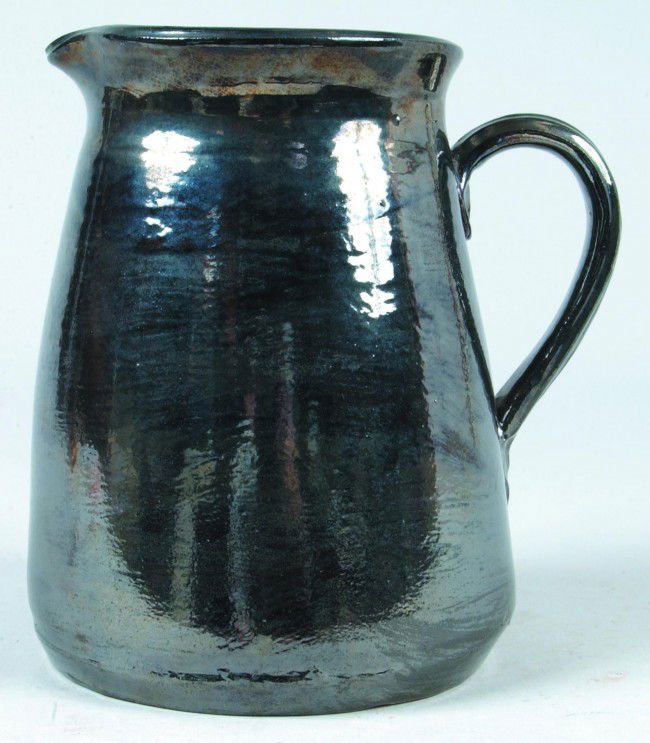 Dorothy Long 1977 Redware Pottery Pitcher, conical: Dorothy Long 1977 Redware Pottery Pitcher, conical shape with pouring spout and applied handle, 8 1/2"h. Condition: Very good.