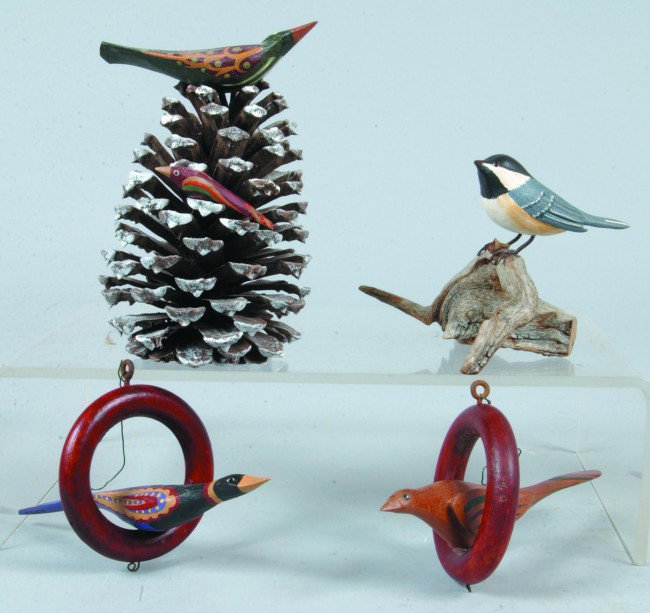 Four Various Bird Carvings, Two signed D. Shaw and: Four Various Bird Carvings, Two signed D. Shaw and polychrome painted, Chicadee signed Hains and realistic painted, one unsigned on pinecone, 3-1/2"h.and 5-1/2"h. Condition: Good.