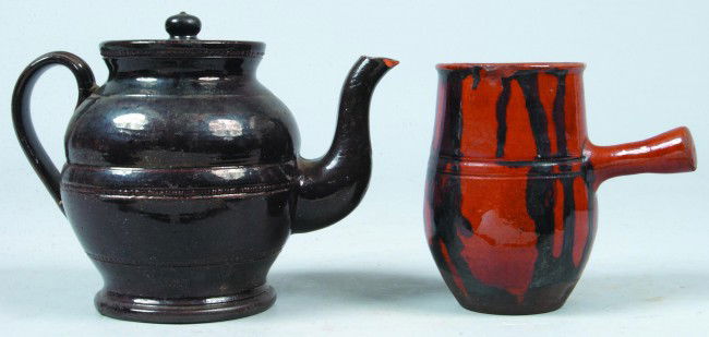 Redware Tea Pot and Side Handle Cream Pitcher wit: Redware Tea Pot and Side Handle Cream Pitcher with drip manganese decorated, teapot pot with manganese glaze, 6-1/4"h. - 5"h. Condition: teapot with Chips and cream pitcher with hairline and chips.