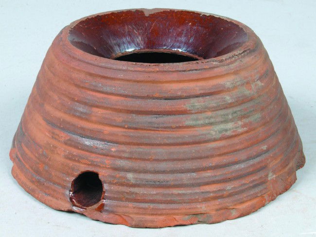 Redware Cuspidor , conical shape with exterior ri: Redware Cuspidor , conical shape with exterior ribbed decoration,3-5/8"h. x 8-1/2"dia. Condition: Base chips.