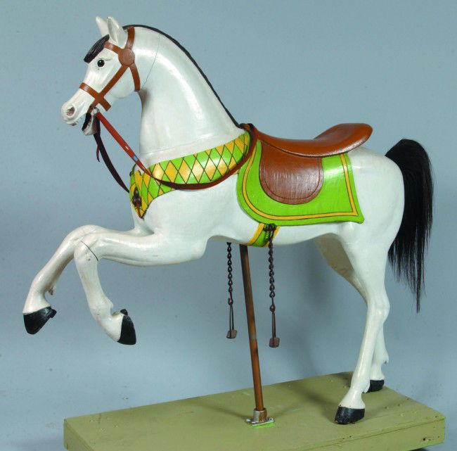 American Early 20th Century Carousel Horse. Later: American Early 20th Century Carousel Horse. Later paint has been done in the original colors and design. Full bodied carving of a rearing horse, mounted on a wood platform. Horse measures 54 1/2" high