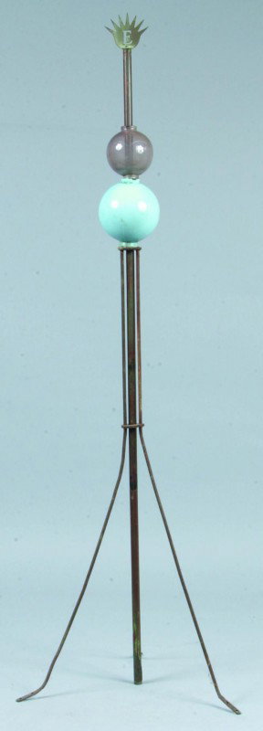 Lightning Rod Having Sunburst with cut out E Termi: Lightning Rod Having Sunburst with cut out E Terminal and having two glass balls insulators, 51"h. Condition: Good with chips on insulators.