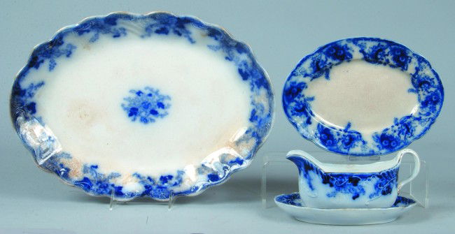 Three Pieces of Flow Blue China , 16-3/4" Platter: Three Pieces of Flow Blue China , 16-3/4" Platter in Cliff pattern by Thomas Hughes & Son, England Condition: Good with stains, Sauce Boat with under tray in Cliff Pattern, same maker, Condition: Good