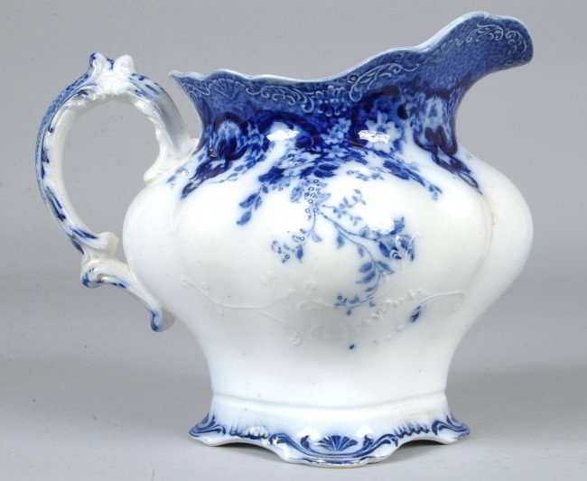 Flow Blue China Richmond Pattern Water Pitcher by: Flow Blue China Richmond Pattern Water Pitcher by Alfred Meakin, 8 3/4"h. Condition: Good.