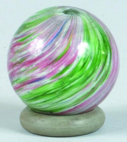 Onionskin Marble, Four Lobbed, red and green swirls: Onionskin Marble, Four Lobbed, red and green swirls with white flecks. 1 3/4" diam. Condition: Very good with minor surface wear.