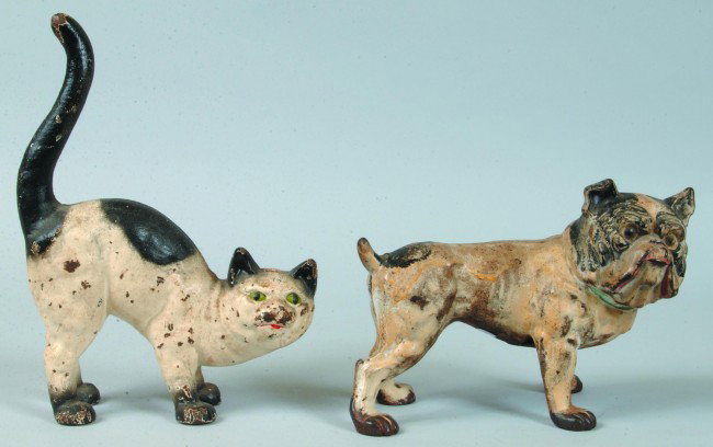 Two Hubley Cast Iron Doorstops; Standing Cat with o: Two Hubley Cast Iron Doorstops; Standing Cat with out-stretched tail, 10 3/4" high (Paint chips and wear) and Bulldog, 6 1/2" high (replaced screw, rust and wear.