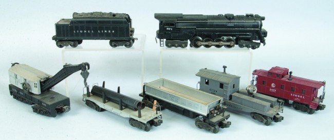 Lionel O Gauge Freight Train Set; 671 Engine, 2466: Lionel O Gauge Freight Train Set; 671 Engine, 2466W Tender, 2411 Gondola (missing 2 uprights), 3459 Automatic Dump Car, 2420 Search Light, 2460 Crane Car and 6457 Caboose. Condition: Good, unless note