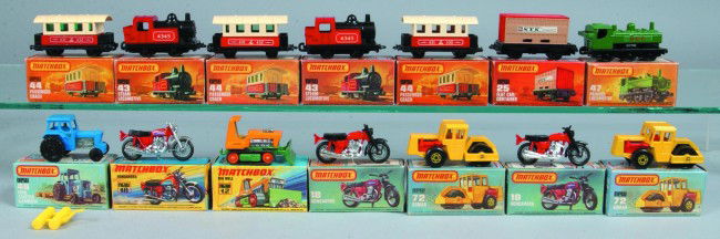 14 Matchbox Vehicles by Lesney, all with original: 14 Matchbox Vehicles by Lesney, all with original boxes; 12 Big Bull, 25 Flatcar/Container, 46 Ford Tractor and Harrow, 47 Pannier Locomotive, (2) 72Bomags, (2) 43 Steam Locomotives, (3) 44 Passenger