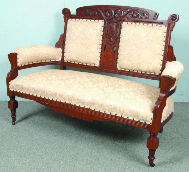 Eastlake Victorian Walnut Carved and Molded Frame : Eastlake Victorian Walnut Carved and Molded Frame Settee with ivory floral pattern damask upholstery. Seat height 17 1/2", 60" long, 39 1/2" high overall.