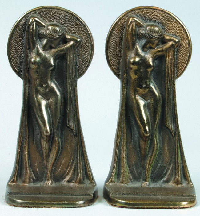 Pair of Art Deco Female Nude Figural Key Hole View: Pair of Art Deco Female Nude Figural Key Hole View Form Cast Iron Bookends with original bronze finish signed Hamilton Foundry (Bluffton, IN, established in 1891). 7 5/8" high. Condition. Good.