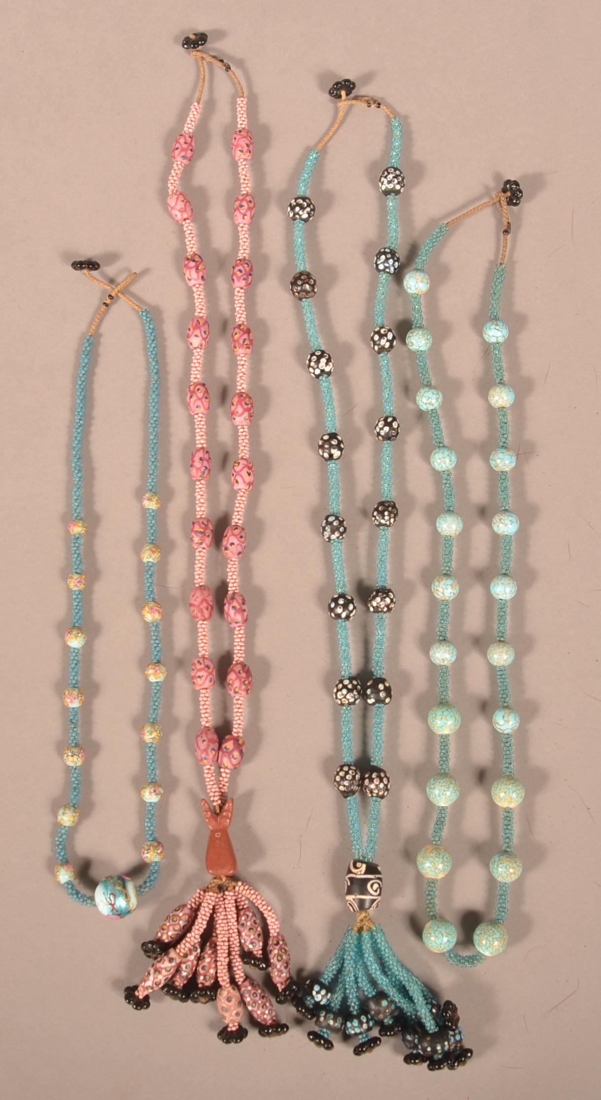 Four Strands of Bead Necklaces.: Four Strands of Bead Necklaces. Circa 1970's, made with antique and vintage glass beads. Condition: Good.