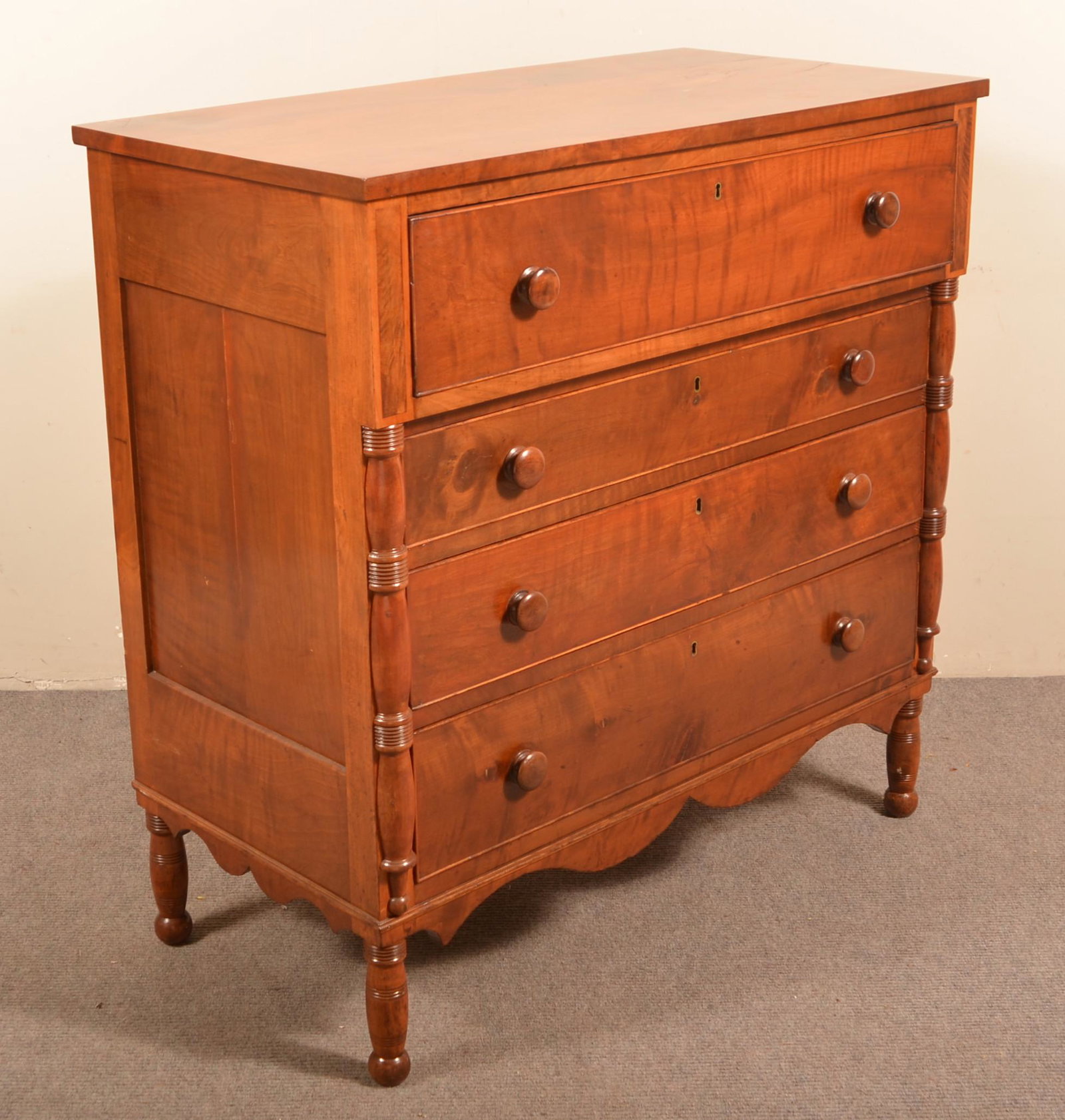 American Empire Burl Mahogany Chest of Drawers.: American Empire Burl Mahogany Veneer Chest of Drawers. Stepped full-width upper drawer above three full-width cock-beaded dovetailed graduated drawers, paneled sides, scalloped skirt turned styles and