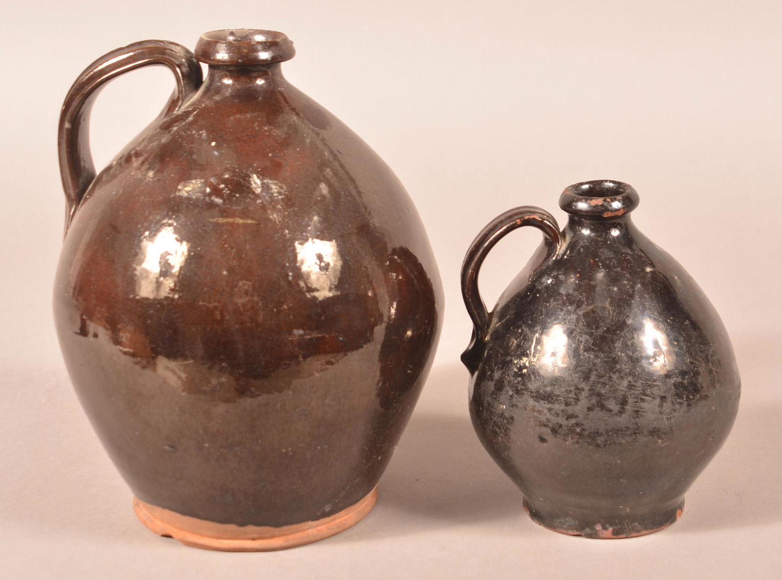 Two Ovoid Manganese Glazed Redware Jugs. (1 of 2)