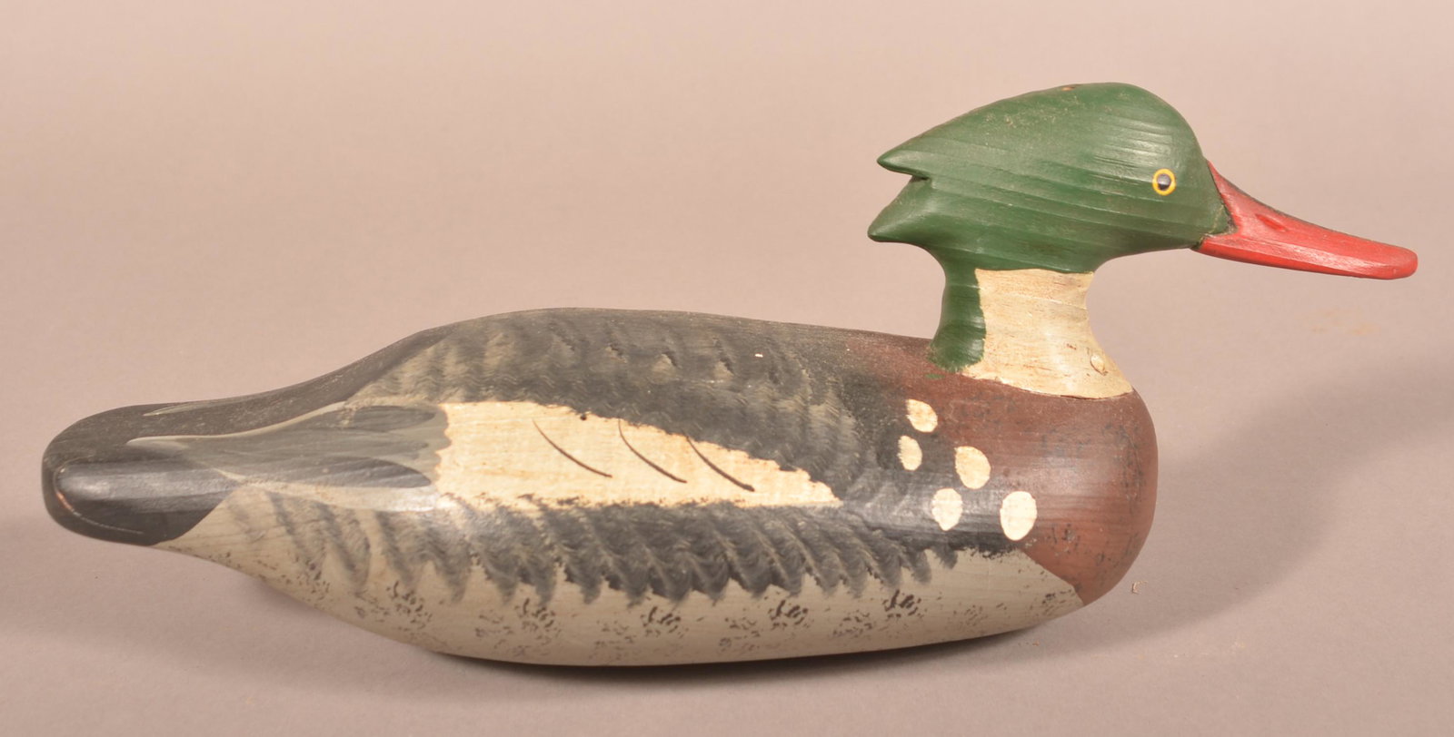 Captain Vernon Bryant Merganser Drake Decoy.: Captain Vernon Bryant Merganser Drake Decoy. Stamped "Bryant" on bottom. Original panted wood surface. 17-1/2'l. Condition: Good with minor wear.