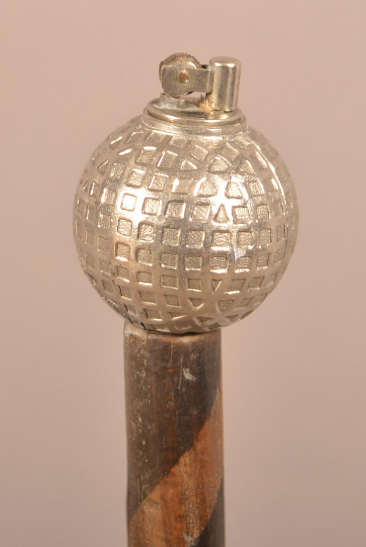 Vintage Walking Stick with Golf Ball Lighter Grip.: Vintage Walking Stick with Golf Ball Lighter Grip. 40"l. Condition: Good, ball has small crack.
