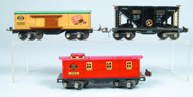 Three Various Lionel Pre-War Cars, #1679 box car, #: Three Various Lionel Pre-War Cars, #1679 box car, #1682 caboose and #653 repainted hopper, all cars show paint loss and wear, but overall good.