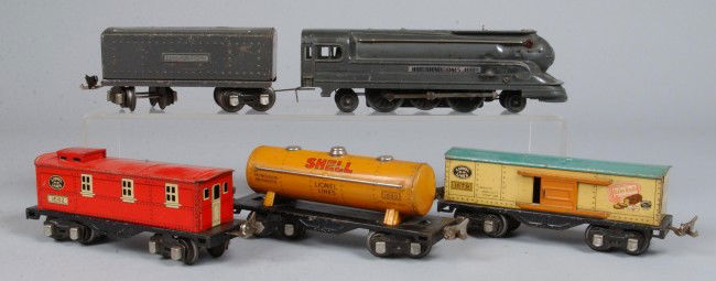 Lionel #1668 Engine with Tender, Three Cars, Track: Lionel #1668 Engine with Tender, Three Cars, Track and Transformers, circa 1938. Overall fair condition, paint loss and surface rust to plated parts including track. Cars included are #1679, 1680 and