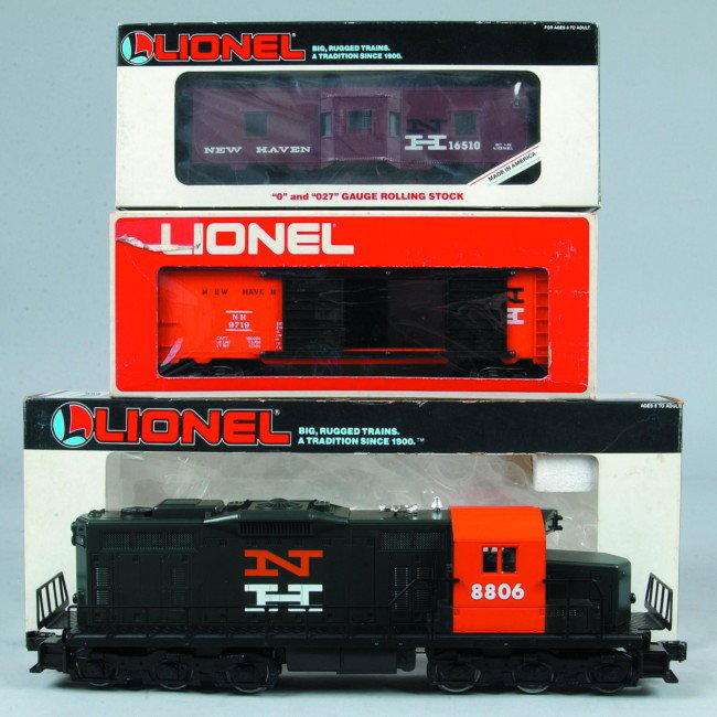 Lionel #6-18806 New Haven SD-18 Diesel with 6-16510: Lionel #6-18806 New Haven SD-18 Diesel with 6-16510 lighted New Haven caboose and NH box car. All pieces are in good condition with original boxes, engine features, six wheel drive, operating head lig