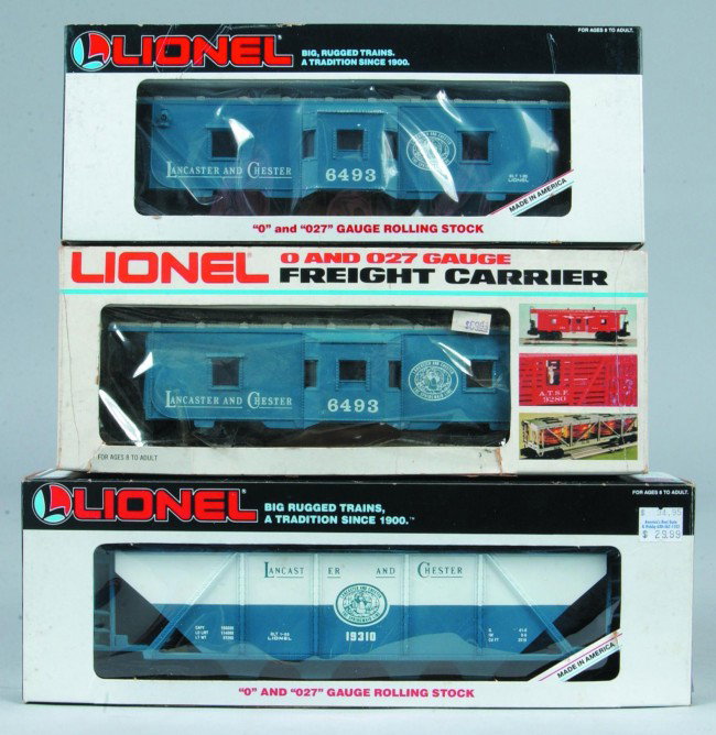 (3) Lionel Lancaster and Chester Cars, (1987), two : (3) Lionel Lancaster and Chester Cars, (1987), two #6-6493 bay window cabooses and a #6-19310 hopper, all three cars are in good condition with original boxes.