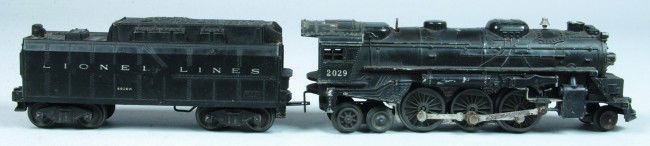 Lionel #2029 Steam Locomotive with 6026W Whistle T: Lionel #2029 Steam Locomotive with 6026W Whistle Tender, circa 1964. Type 1 locomotive that is in overall fair to good condition showing various paint loss to locomotive body, surface rust to plated p