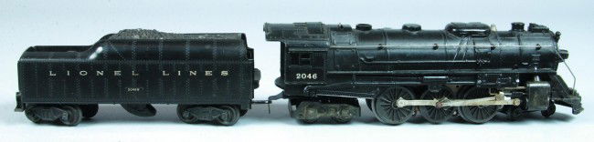 Lionel #2046 Steam Engine with #2046 Tender, (Type: Lionel #2046 Steam Engine with #2046 Tender, (Type 1). Overall good condition having paint loss and fading, tender includes original box with box pieces showing normal use and wear.